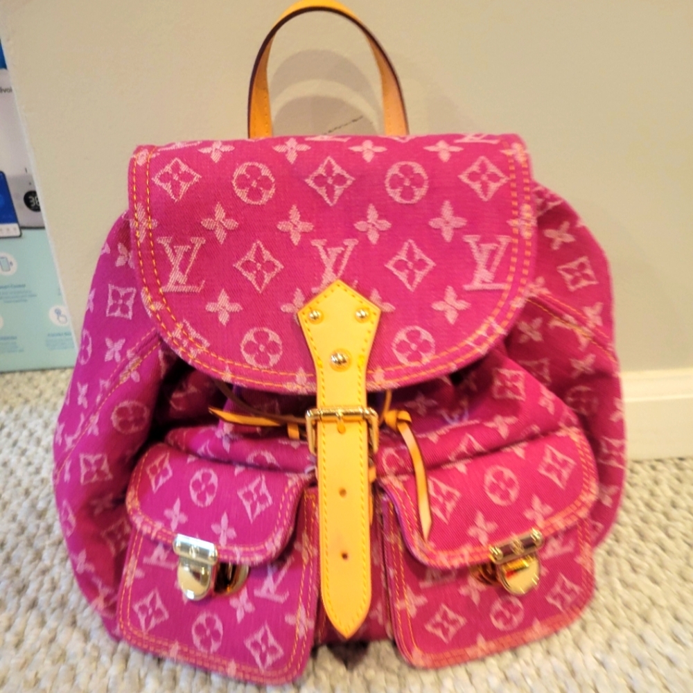 Hot pink mini logo backpack purse bag.